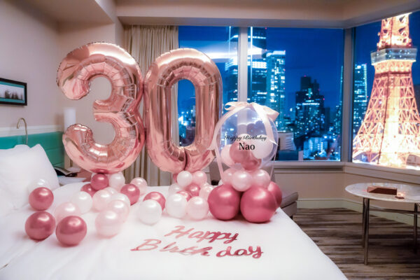 Clear balloons with ribbon and big number decorations