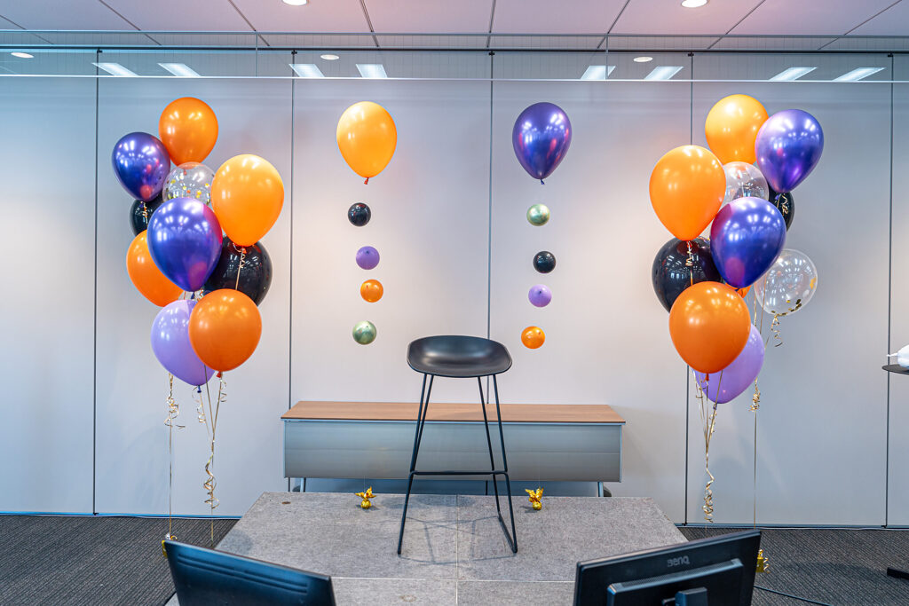 Fan Meeting at an Office in Ginza: Orange and Purple Balloon Decorations