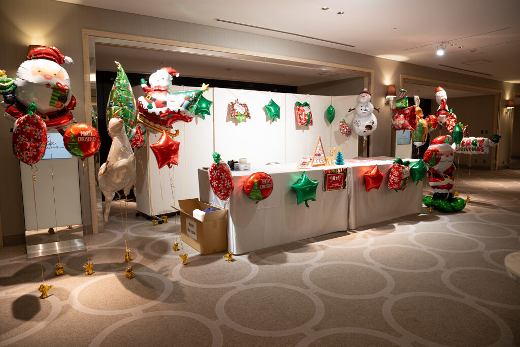 Christmas party reception decorations with red and green balloons at Tokyo Marriott Hotel