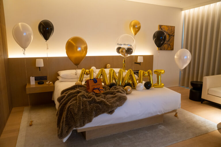 Luxurious gold & black birthday surprise decoration in a hotel room at 東京エディション虎ノ門