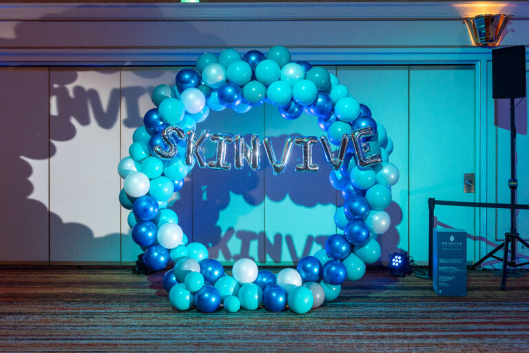 Launch event decoration at Tokyo Prince Hotel, featuring a blue-toned balloon arch