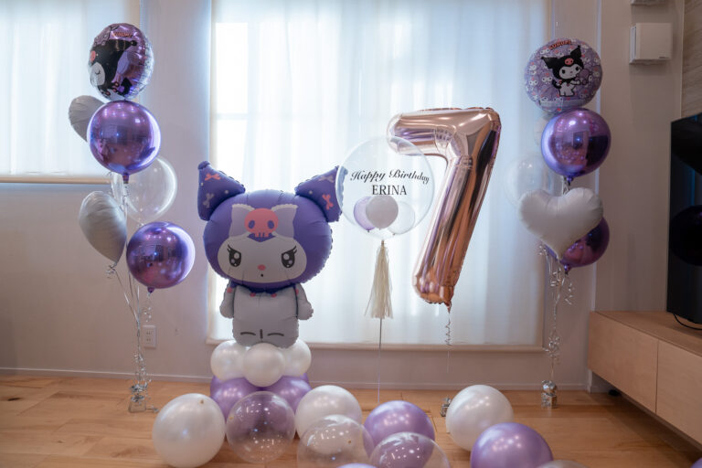 Celebrating a 7th Birthday with Purple and White Balloon Decorations