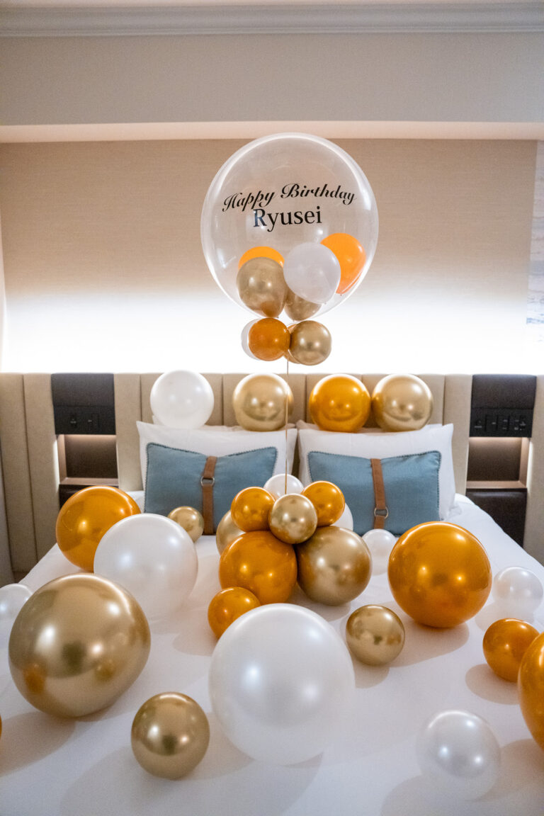 Birthday surprise decoration with gold & white balloons at Kobe Meriken Park Oriental Hotel