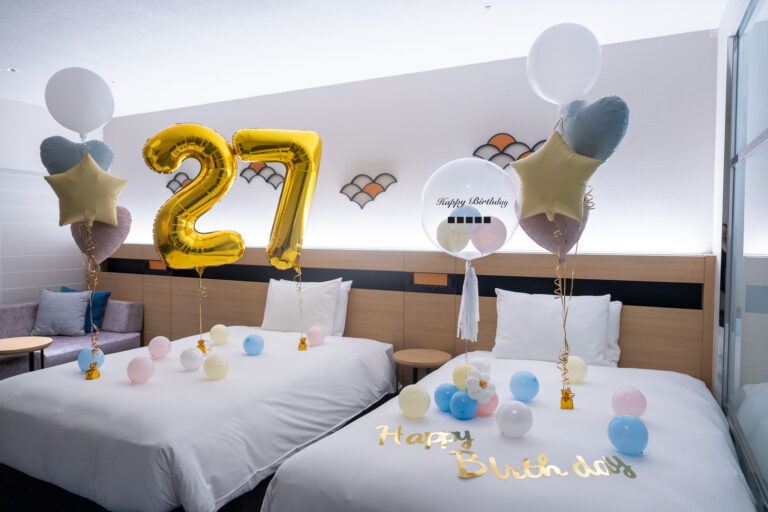 Surprise 27th birthday decoration with gold & white balloons at Hilton Tokyo Bay