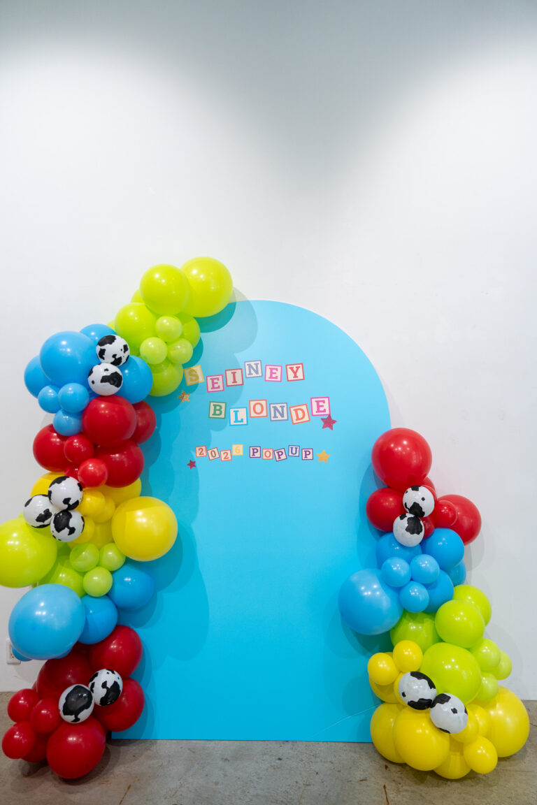 Colorful photo spot decoration with cow-print balloons at Jinnan pop-up store