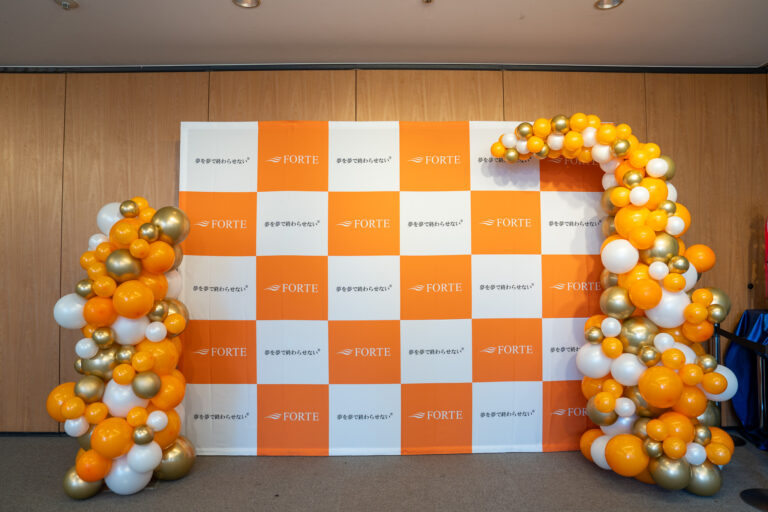 Orange & gold balloon decoration for an award ceremony held at a commercial facility in Ebisu