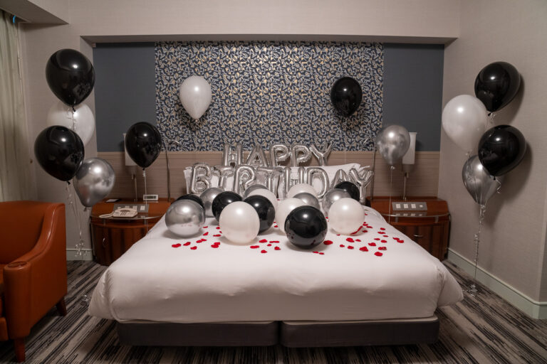 Birthday surprise decoration with silver & black balloons in a guest room at ザ・プリンスパークタワー東京